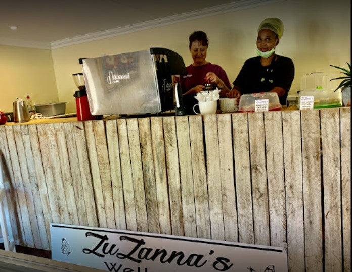 Two ZuZannas Employees at the counter